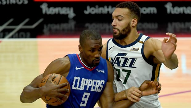 Feb 17, 2021; Los Angeles, California, USA; Los Angeles Clippers center Serge Ibaka (9) moves to the basket past Utah Jazz center Rudy Gobert (27) in the first half of the game at Staples Center. Mandatory Credit: Jayne Kamin-Oncea-USA TODAY Sports